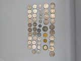 a lot of coins that are on the table