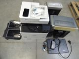 a lot of electronics that are sitting on the floor