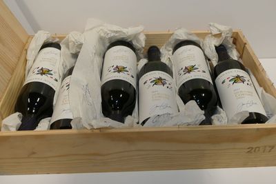 six bottles of wine in a wooden box