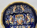 a blue and gold plate with a design on it