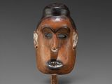 an image of a wooden mask with a face on it