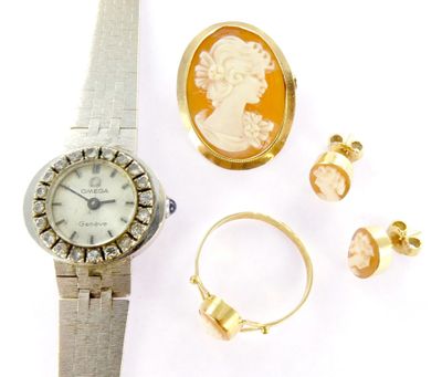 an image of a lady ' s watch, bracelet, ring, and earring