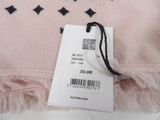 pink sweater with black stars on it and a price tag on it