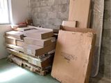 a pile of boxes and boxes on the floor in a room