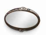 a round mirror with a decorative design on the rim