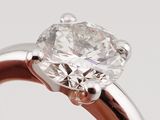 a close up of a diamond ring on a white background