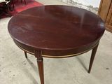 an image of a round table with a wooden top