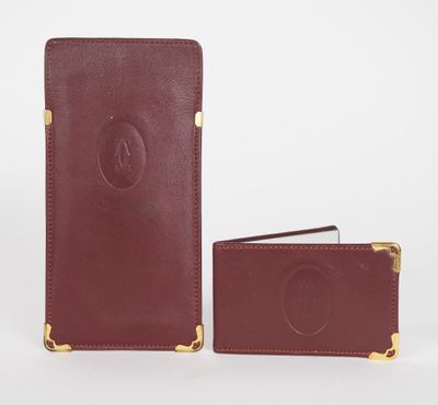 a brown leather wallet with a gold clasp and a card holder