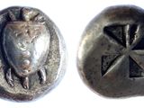 a close up of a silver coin with a bird on it