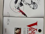 a book with a drawing of a woman holding a knife