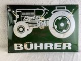a green sign with a picture of a tractor on it