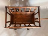 a wooden box with wheels attached to the back of it
