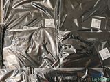 many bags of clothing sitting on top of each other