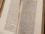 an open book that is sitting on a table