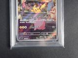 the pokemon card is in a clear plastic holder on a black surface
