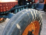 a close up of a tractor tire on the ground