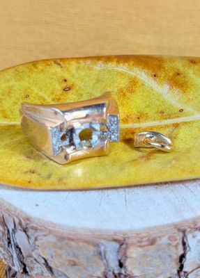 a ring sitting on top of a bowl on a table