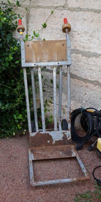 a chair that is sitting on the ground next to a wall