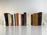 a lot of books that are sitting on a table