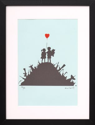 a framed picture of a couple holding hands on top of a hill