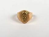 a close up of a gold ring with the letter s on it