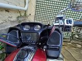 a red motorcycle parked in front of a building