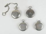 three silver pocket watches and a chain on a white surface