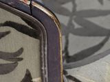a close up of a purse on a chair