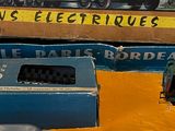 two toy trains that are sitting on a table