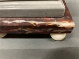 a marble sculpture on wheels on a table