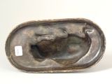 a bronze sculpture of a woman and a cat on a plate