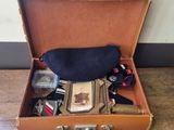 a suitcase with a lot of things in it on the floor