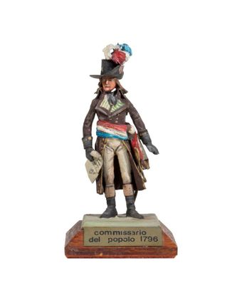 statue of a man in a top hat and coat holding a rifle