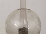 a glass lamp that is sitting on a table