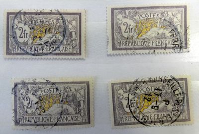 four different stamps with a lion on them on a white surface