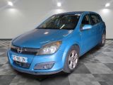 a picture of a blue car parked in a garage