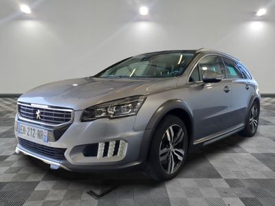 a picture of a silver car in a showroom
