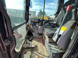 a view of the inside of a bus from the driver ' s seat