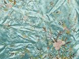 an image of a close up of a piece of fabric with flowers and birds on it