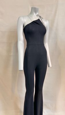 the mannequin is wearing a black jumpsuit and a white top