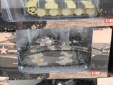 many different types of toy tanks on display in a store