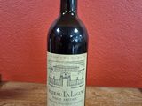 a bottle of wine that is sitting on a table