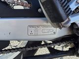 a close up of a motorcycle with a chain attached to it