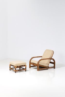an image of a chair and ottoman in a white room