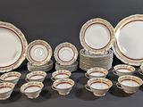 many different types of plates and bowls on the table