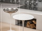 two tables that are sitting in front of a fireplace