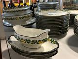 many plates and bowls on the counter in the store
