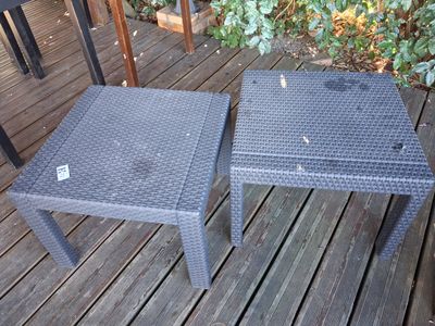 a table and a chair on a wooden deck