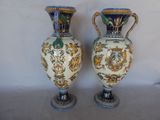 two vases that are sitting side by side on a table