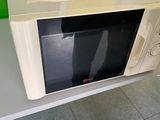 a microwave that is sitting on a table in a room
